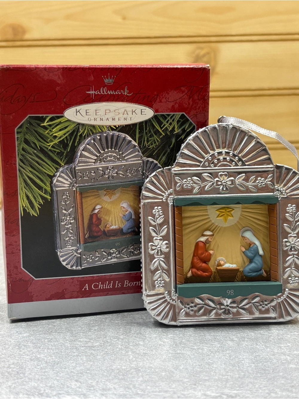 Hallmark Silver Nativity Ornament with Red and Blue Figures